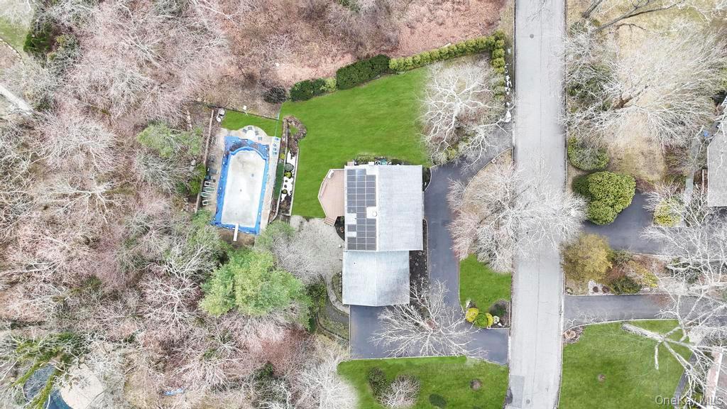 10 Hunting Hill Road Woodbury, NY 11797 - Photo 34 of 39 an aerial view of a house with a yard and plants