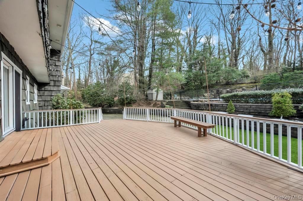 10 Hunting Hill Road Woodbury, NY 11797 - Photo 38 of 39 a view of backyard with deck and wooden floor