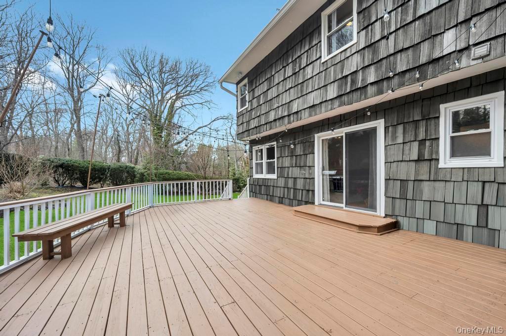 10 Hunting Hill Road Woodbury, NY 11797 - Photo 39 of 39 a view of a house with a wooden deck