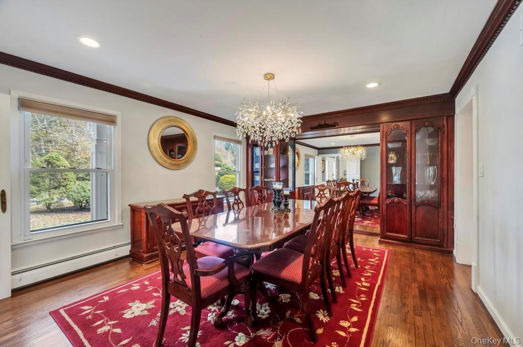 10 Hunting Hill Road Woodbury, NY 11797 - Photo 7 of 39 a view of a dining room with furniture window and wooden floor