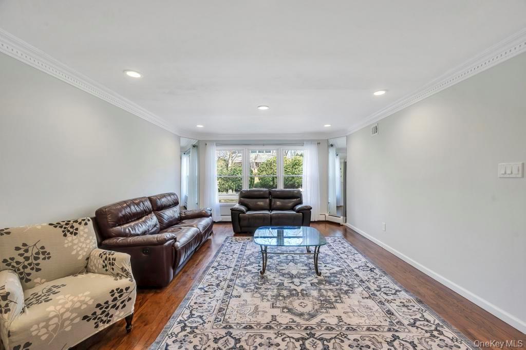 10 Hunting Hill Road Woodbury, NY 11797 - Photo 8 of 39 a living room with furniture and a couch