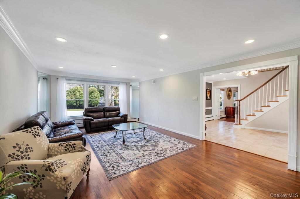 10 Hunting Hill Road Woodbury, NY 11797 - Photo 9 of 39 a living room with furniture and a table