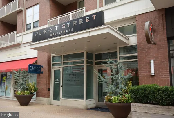 a view of a house with potted plants
