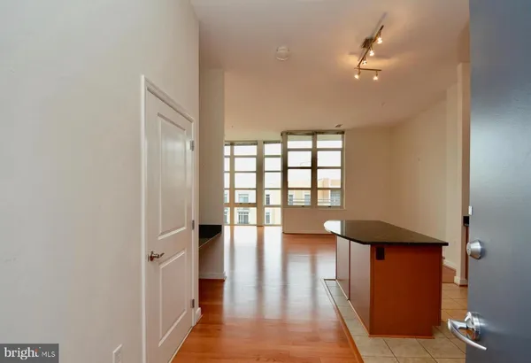 a kitchen with stainless steel appliances granite countertop a sink a stove and refrigerator