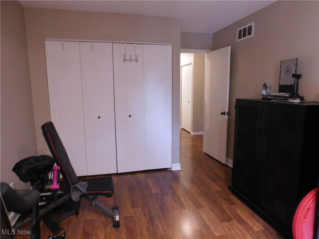 987 Hampton Ridge Drive Akron, OH 44313 - Photo 30 of 49 Bedroom with dark wood-type flooring and a closet