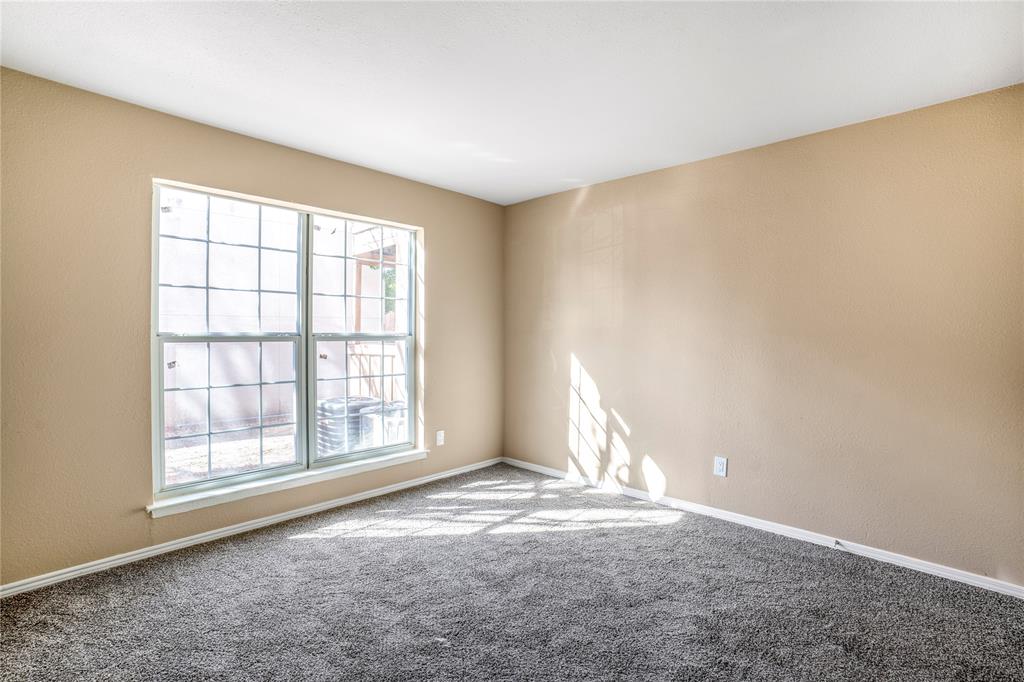 8110 Skillman Street, Unit 1027 Dallas, TX 75231 - Photo 11 of 19 an empty room with windows