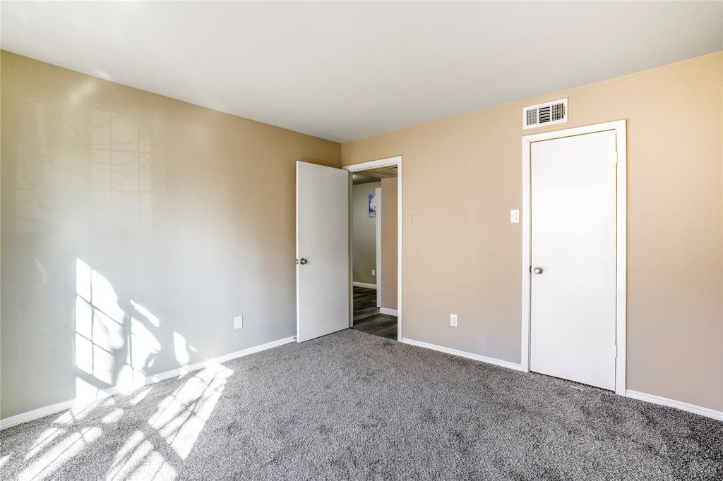 8110 Skillman Street, Unit 1027 Dallas, TX 75231 - Photo 10 of 19 a view of an empty room and window