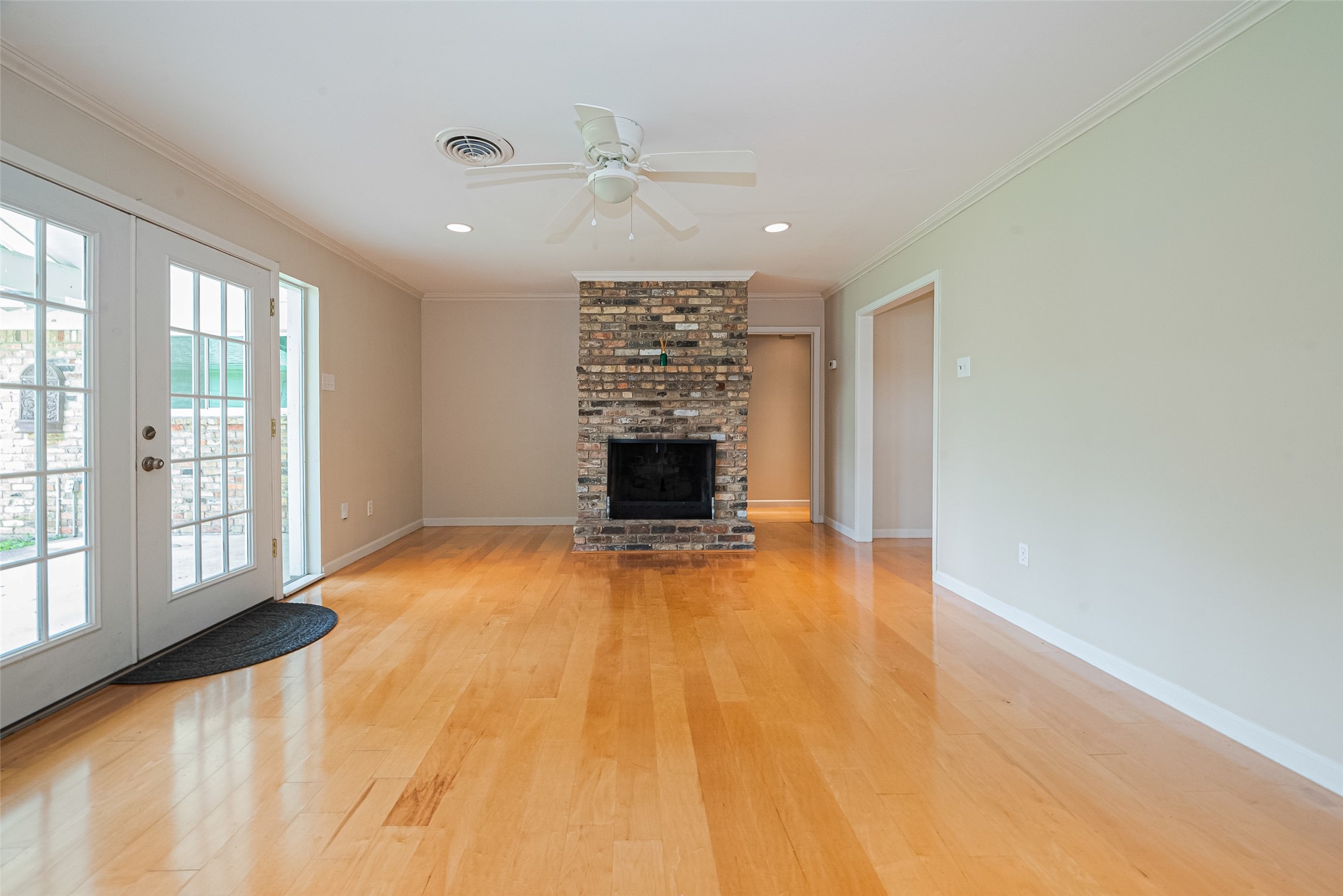 4834 Sanford Road Houston, TX 77035 - Photo 18 of 46 a view of an empty room with a fireplace and a window