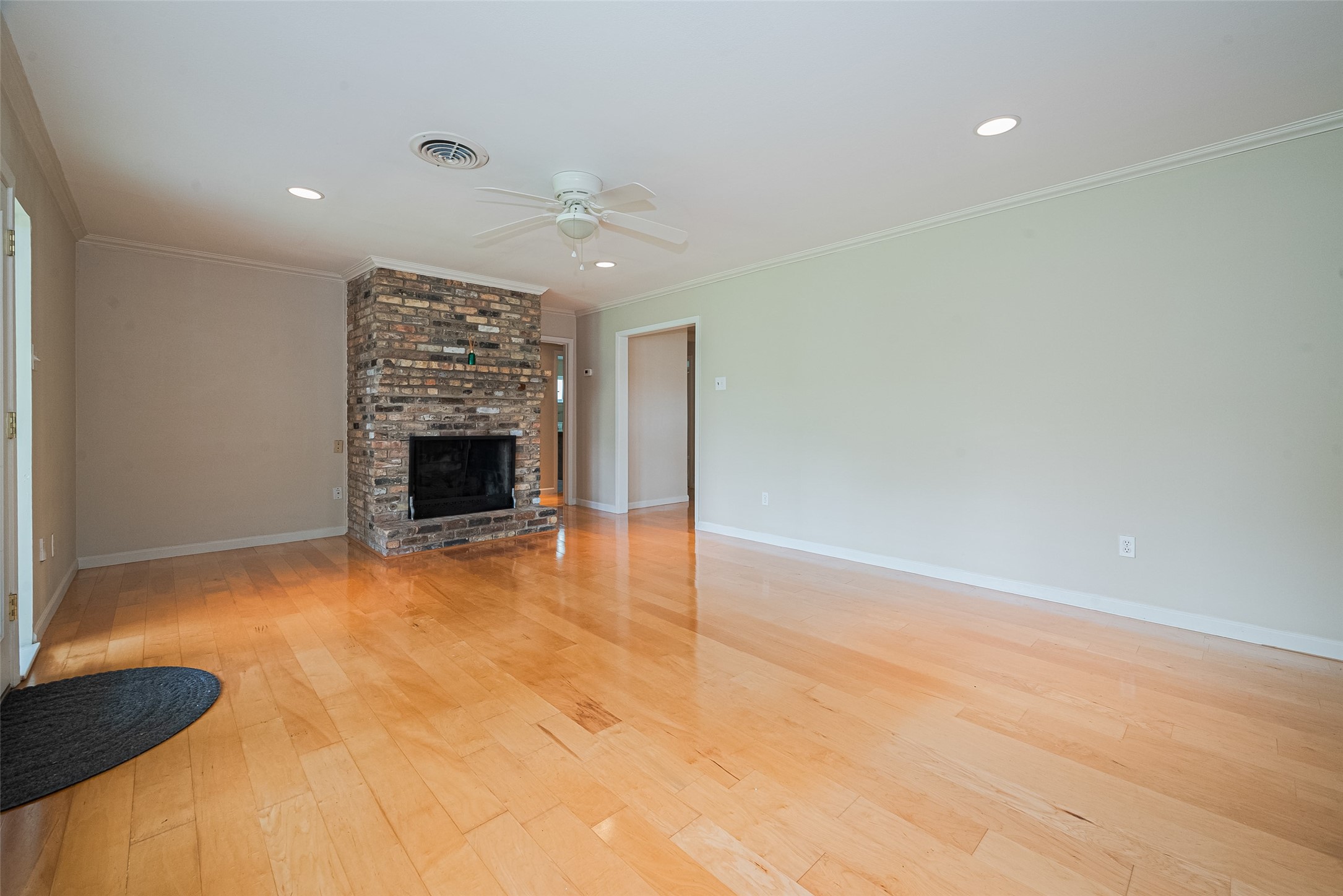 4834 Sanford Road Houston, TX 77035 - Photo 19 of 46 a view of an empty room with a fireplace