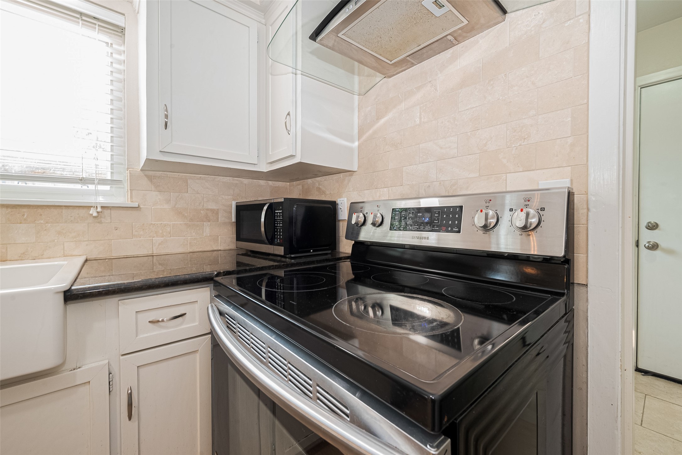 4834 Sanford Road Houston, TX 77035 - Photo 25 of 46 a stove top oven sitting inside of a kitchen