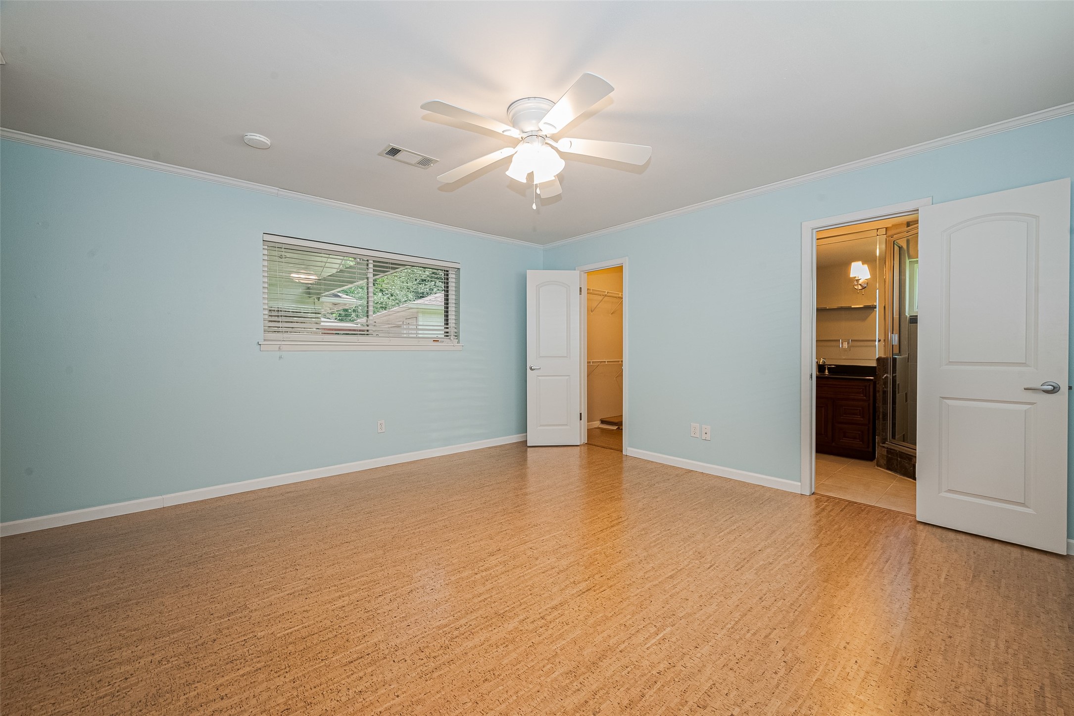 4834 Sanford Road Houston, TX 77035 - Photo 30 of 46 a view of an empty room with wooden floor and a ceiling fan