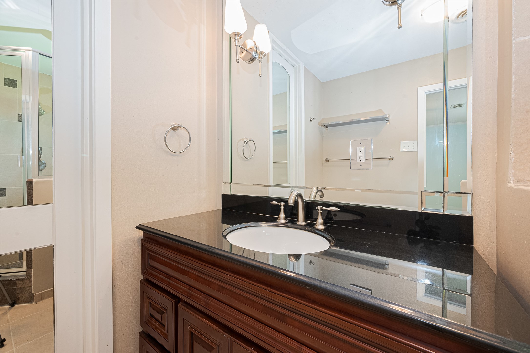 4834 Sanford Road Houston, TX 77035 - Photo 34 of 46 a bathroom with a sink and a mirror