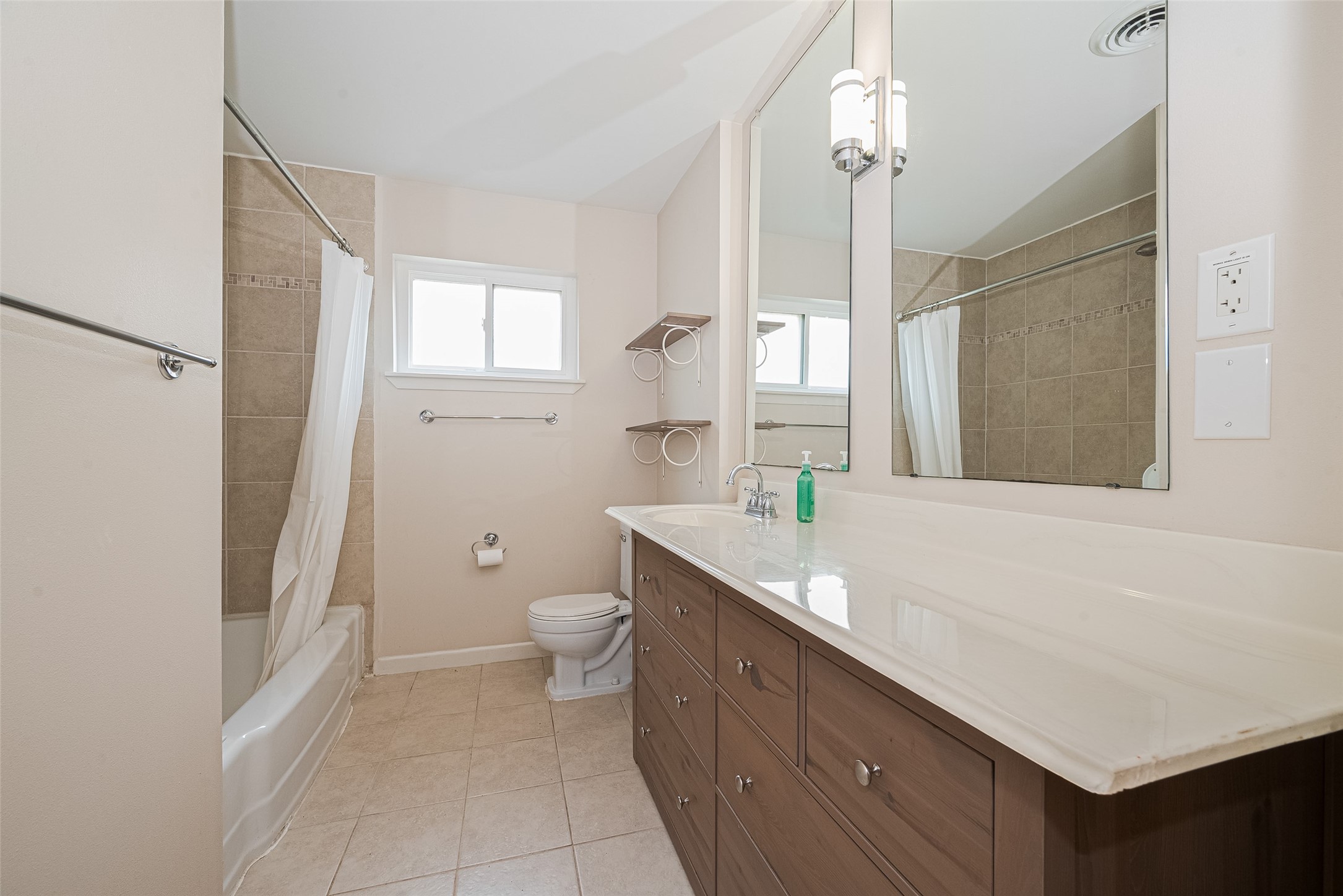 4834 Sanford Road Houston, TX 77035 - Photo 37 of 46 a bathroom with a granite countertop sink a toilet and a bathtub