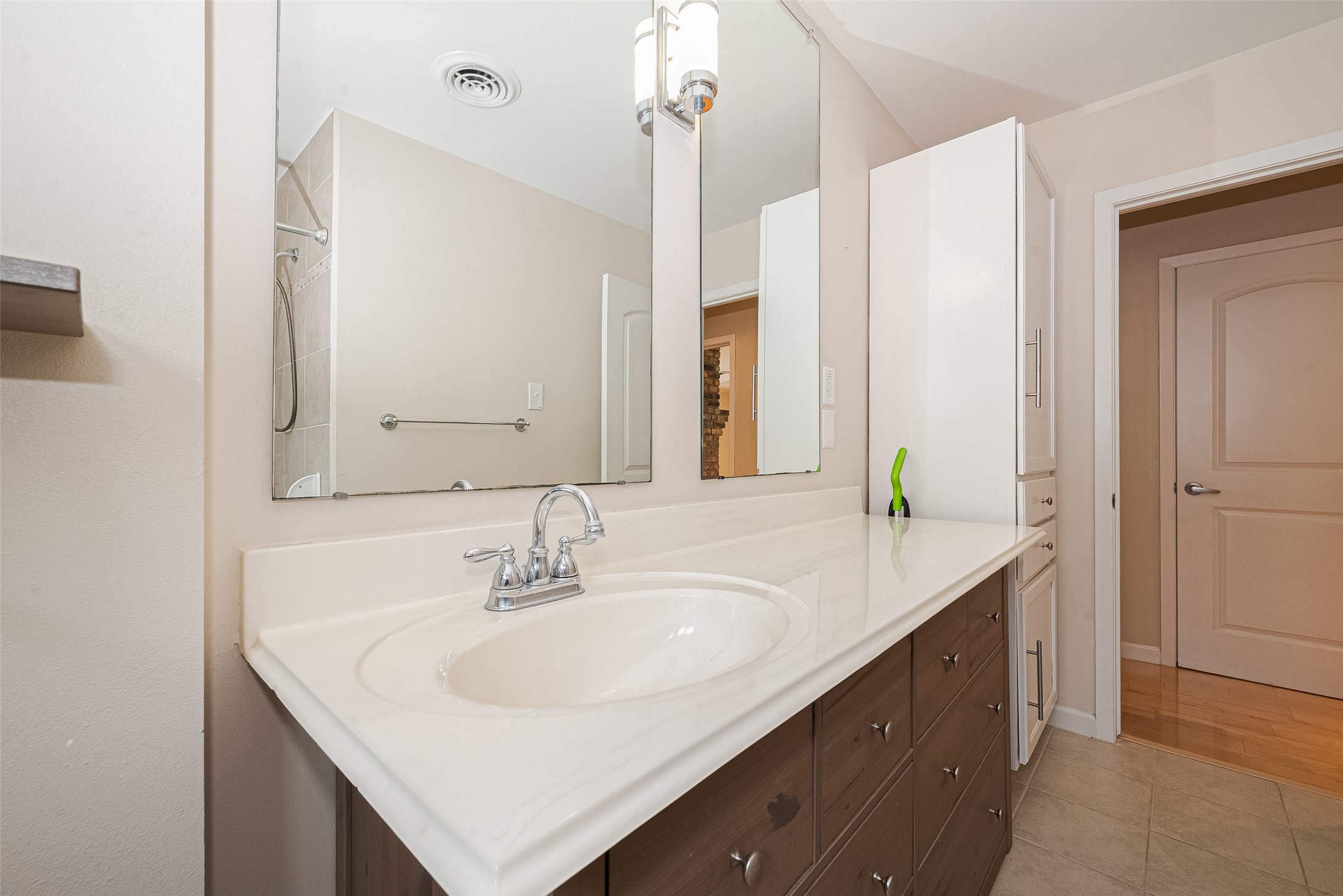 4834 Sanford Road Houston, TX 77035 - Photo 39 of 46 a bathroom with a sink and a mirror