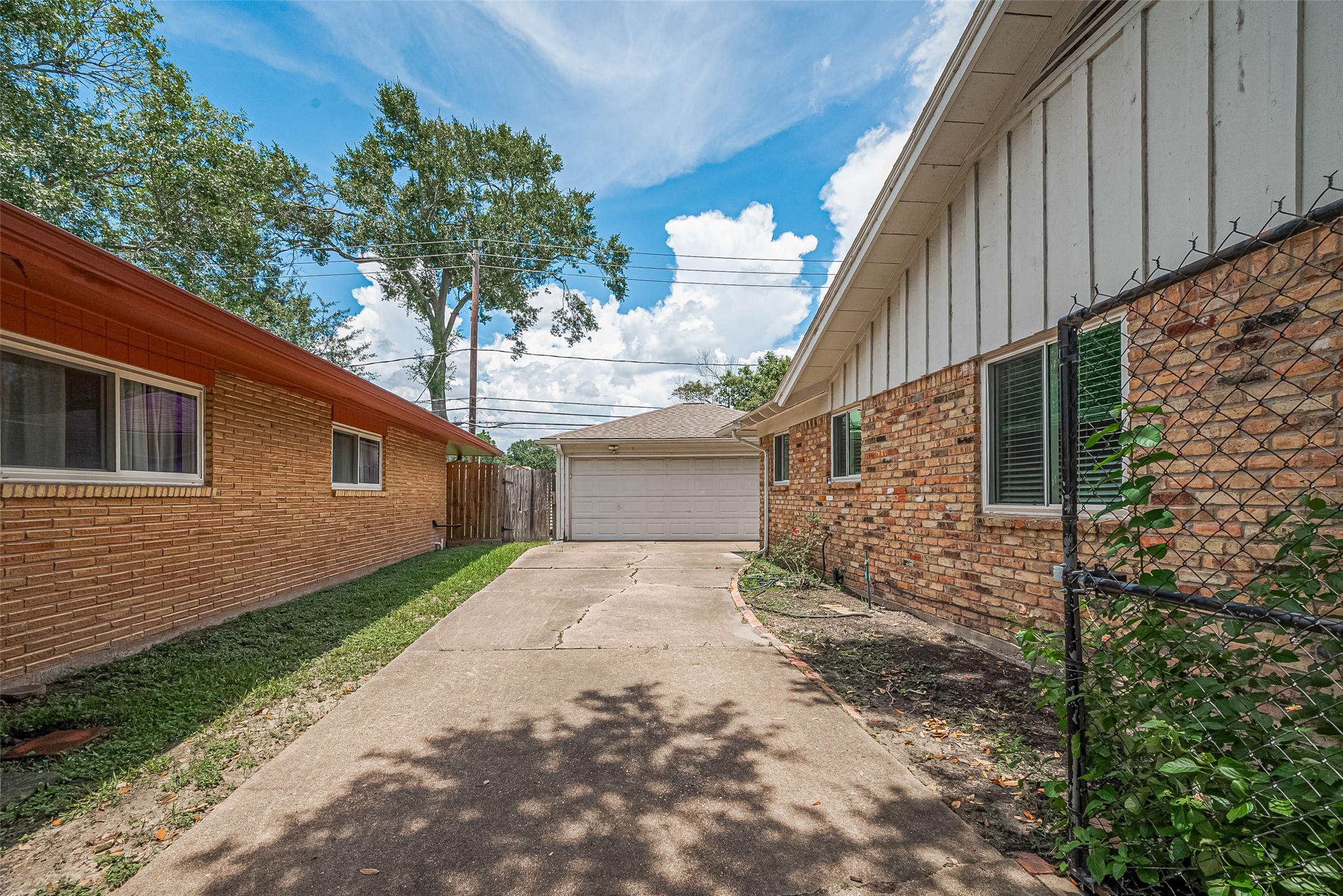 4834 Sanford Road Houston, TX 77035 - Photo 42 of 46 a front view of a house with a yard and garage