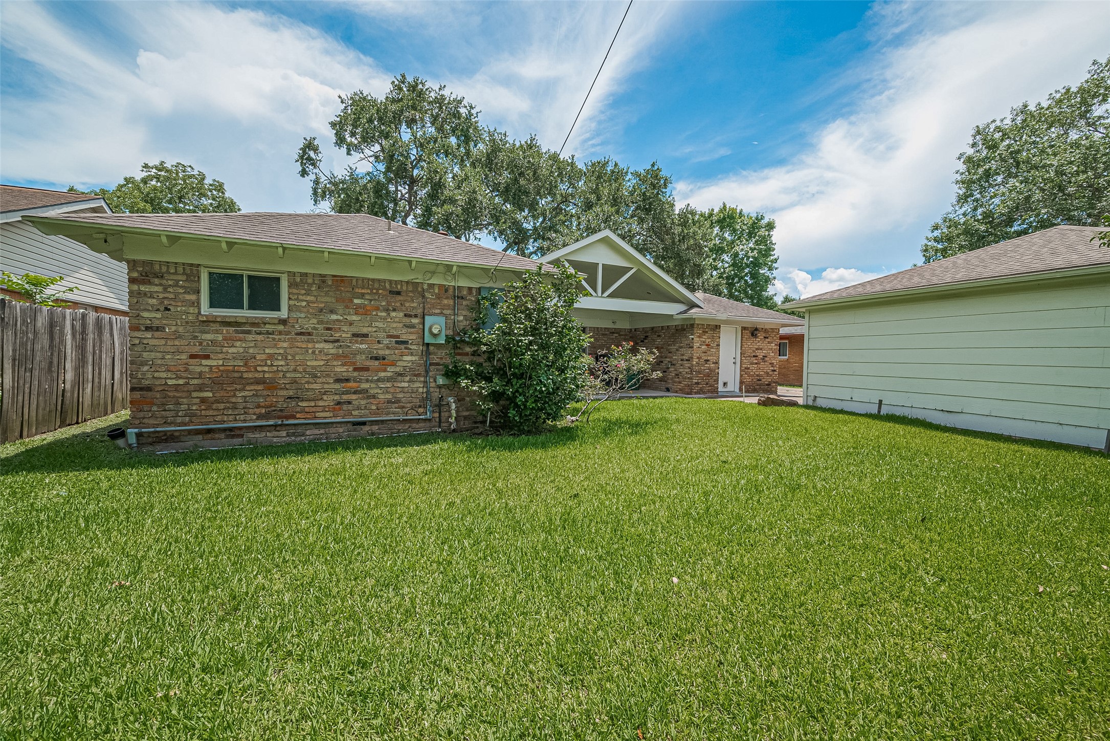 4834 Sanford Road Houston, TX 77035 - Photo 45 of 46 a front view of a house with a garden
