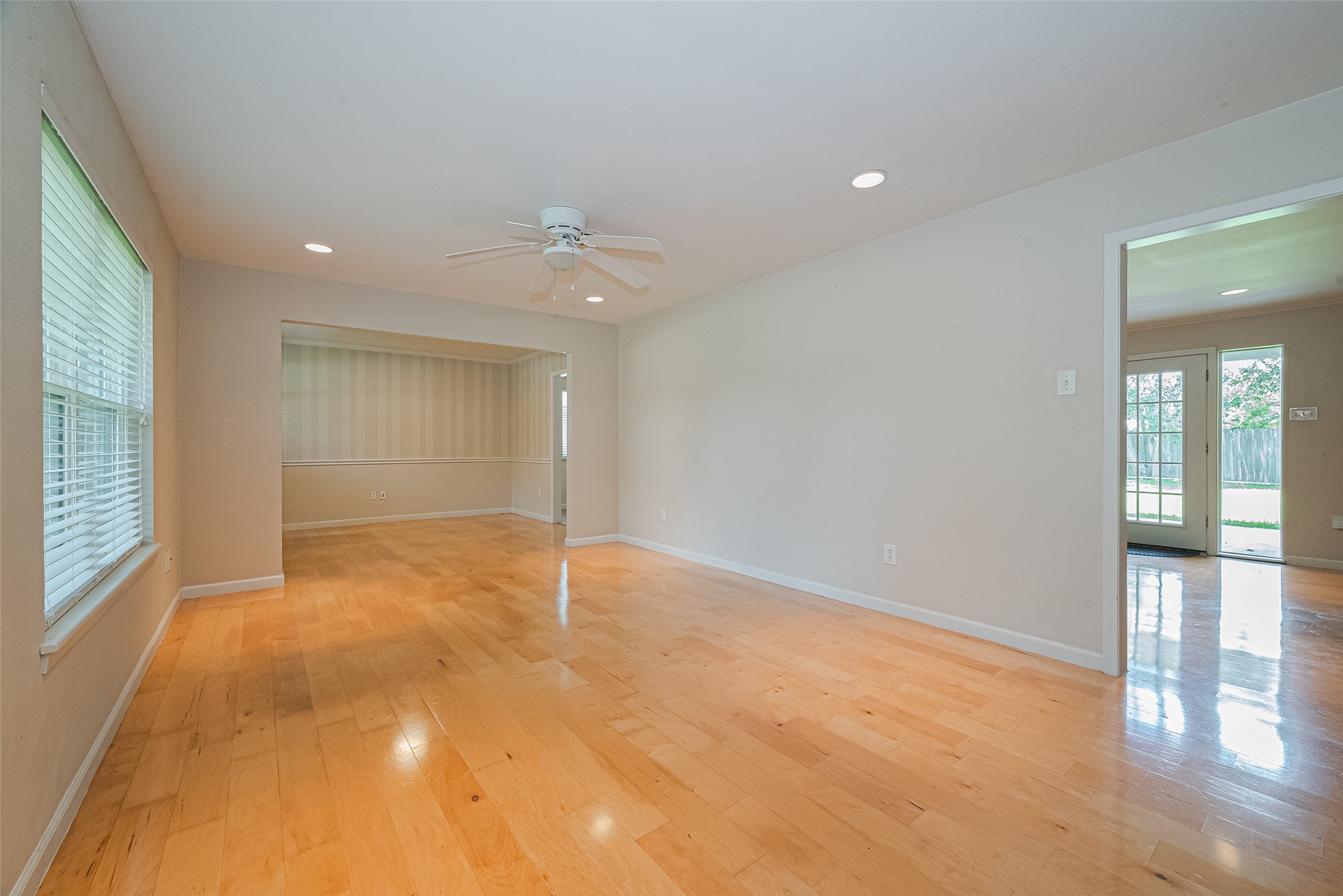 4834 Sanford Road Houston, TX 77035 - Photo 8 of 46 an empty room with wooden floor and windows