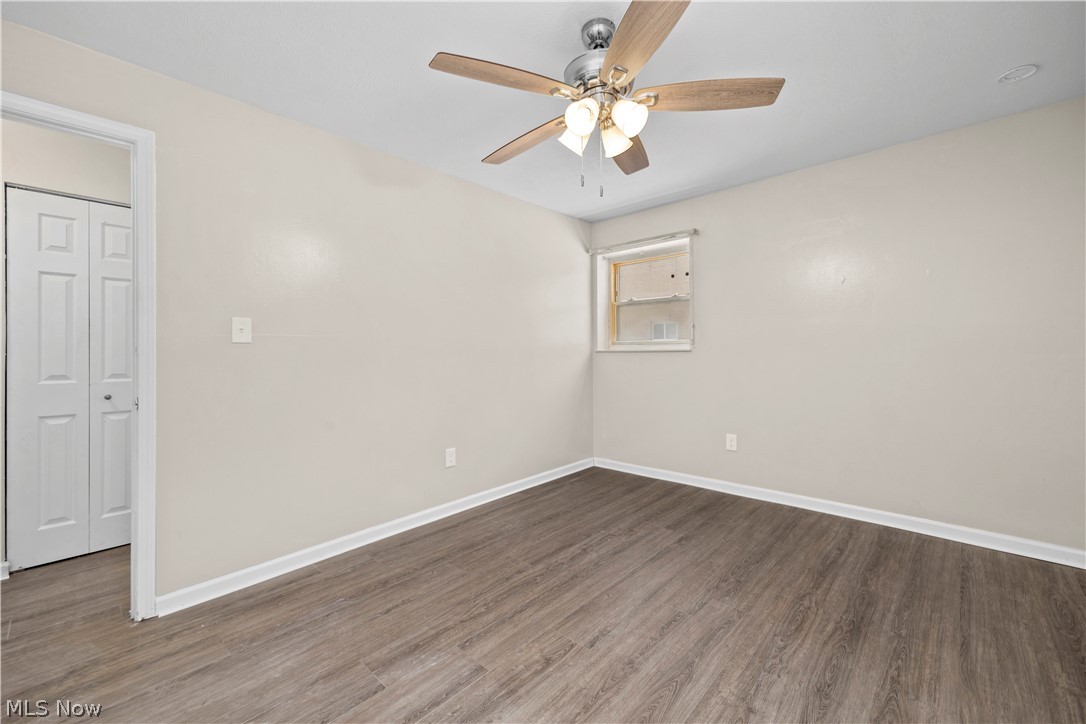 5382 Lee Road, Unit 102 Maple Heights, OH 44137 - Photo 19 of 25 Unfurnished room featuring ceiling fan and wood finished floors