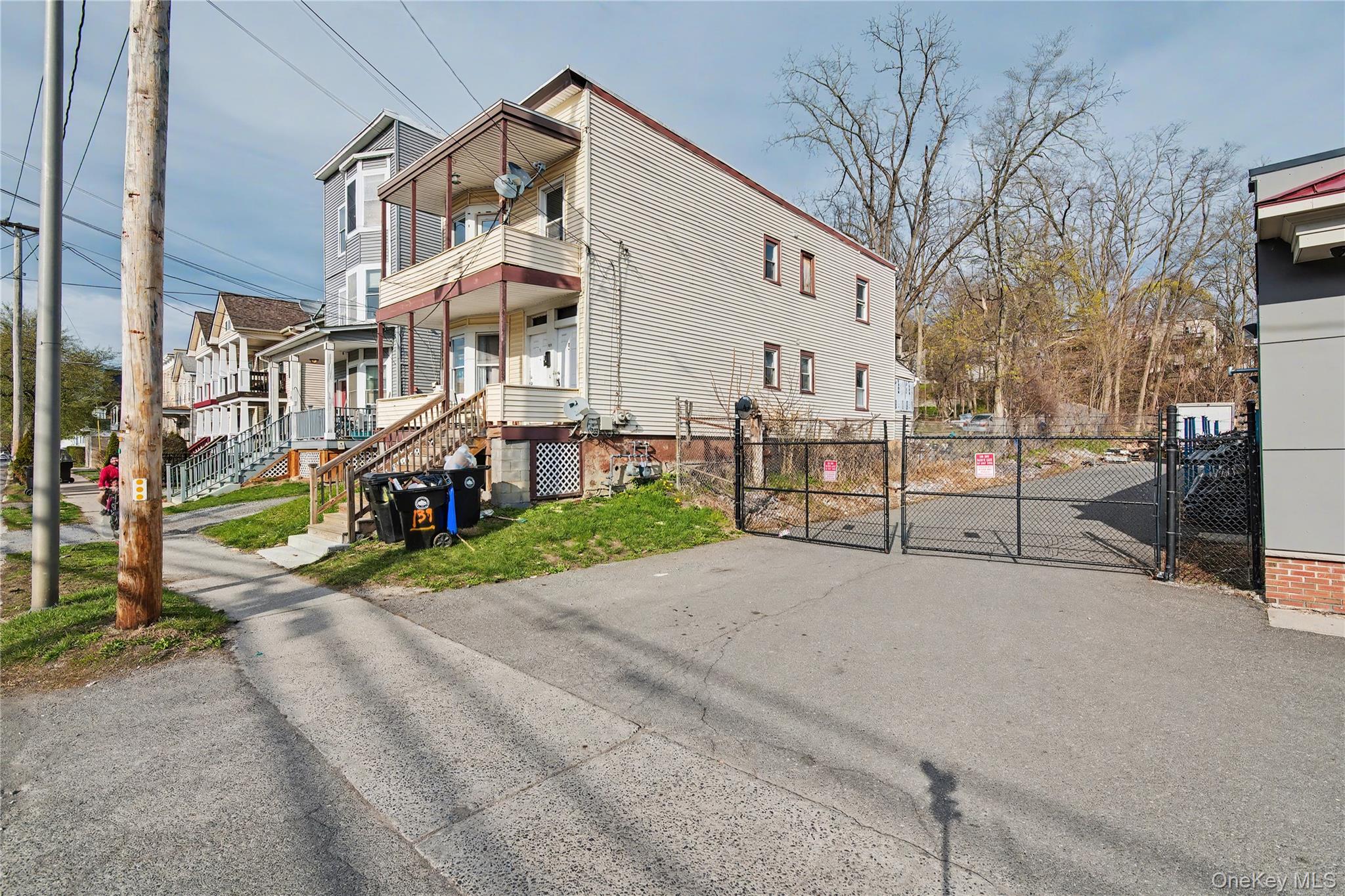 139 North Hamilton Street, Unit 2 Poughkeepsie, NY 12601 - Photo 2 of 15 a view of a building with a yard