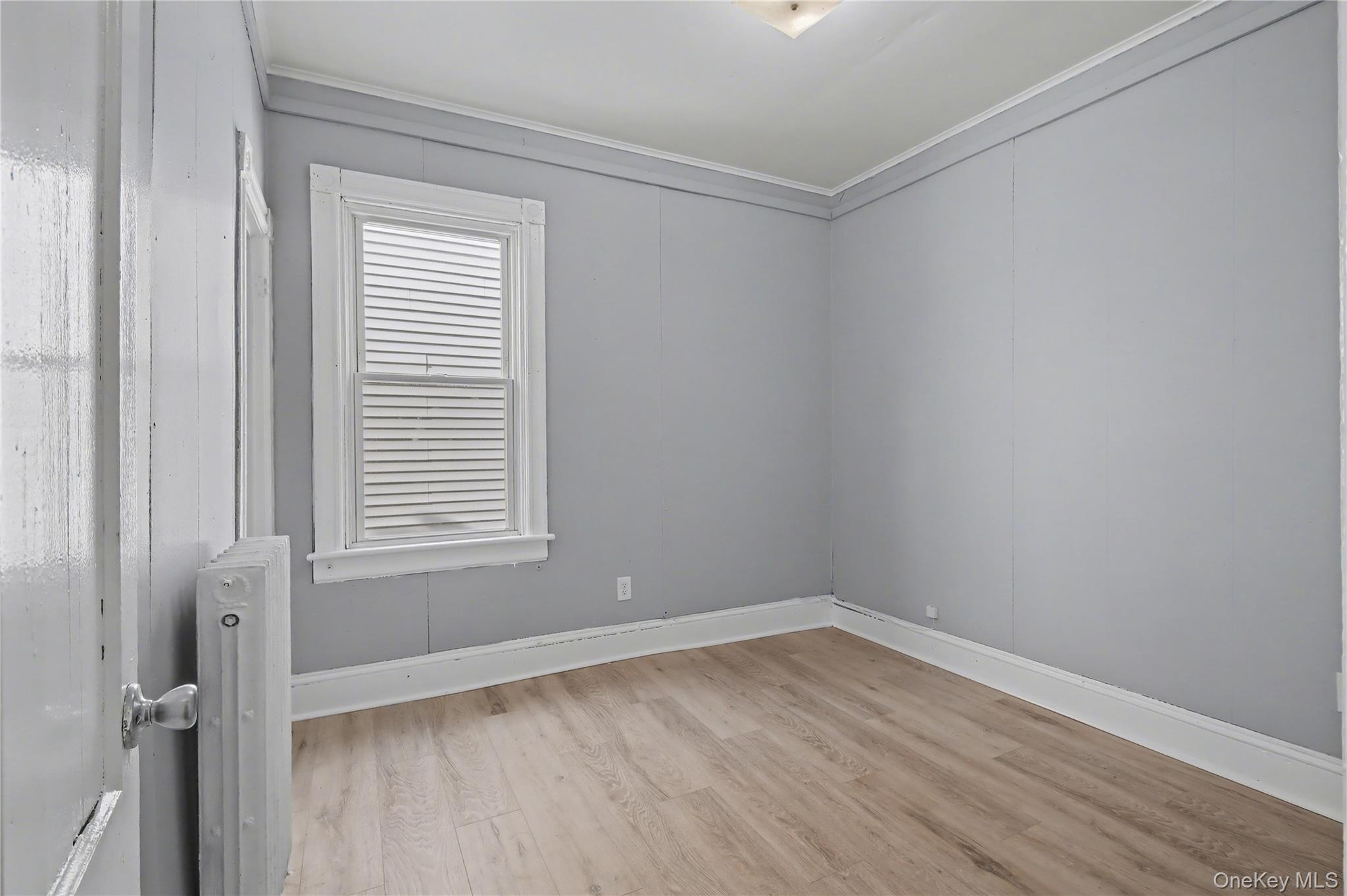 139 North Hamilton Street, Unit 2 Poughkeepsie, NY 12601 - Photo 9 of 15 an empty room with a window