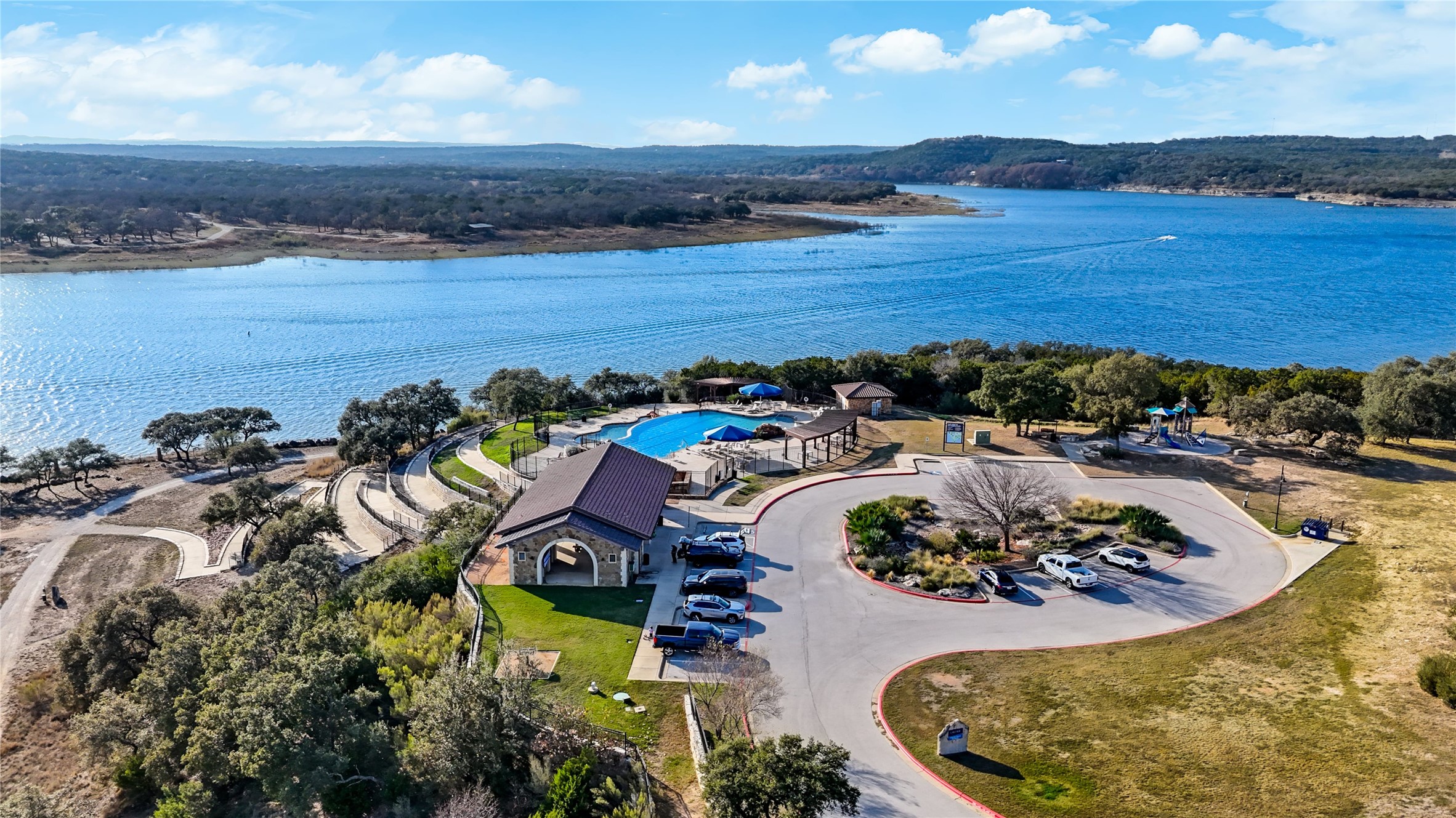 7705 Pace Ravine Drive Lago Vista, TX 78645 - Photo 39 of 40 Drone / aerial view of a pool and a nearby body of water