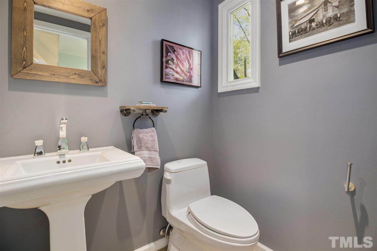 2908 Sandia Drive Raleigh, NC 27607 - Photo 19 of 29 Convenient Main floor powder room is beautiful like all baths in this home.