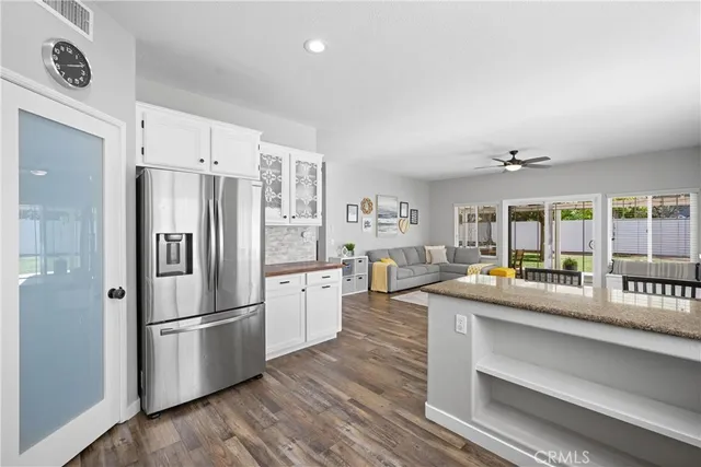 a kitchen with refrigerator and stove
