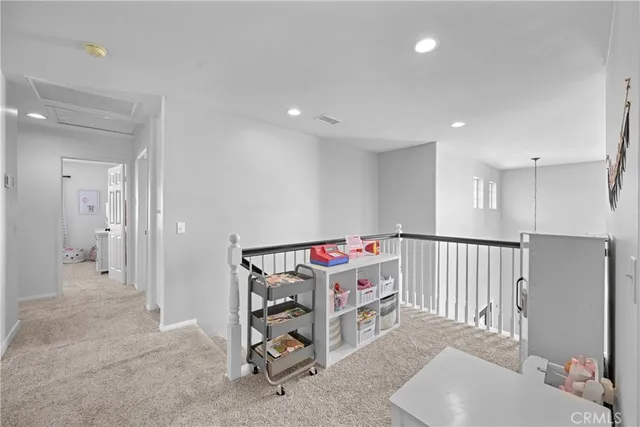 a bedroom with furniture and white walls