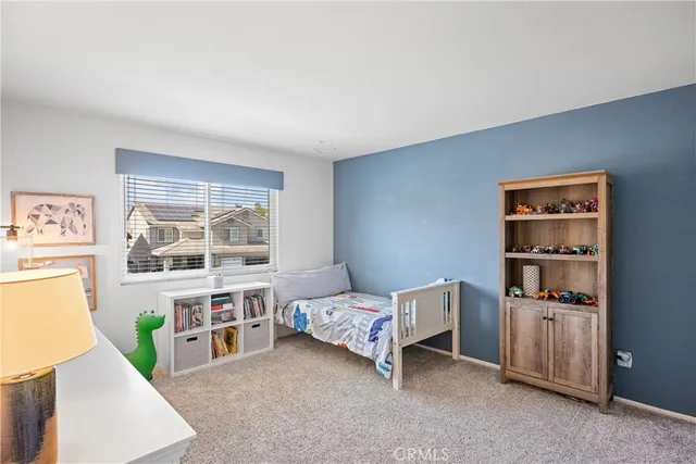 a bedroom with a bed and a closet