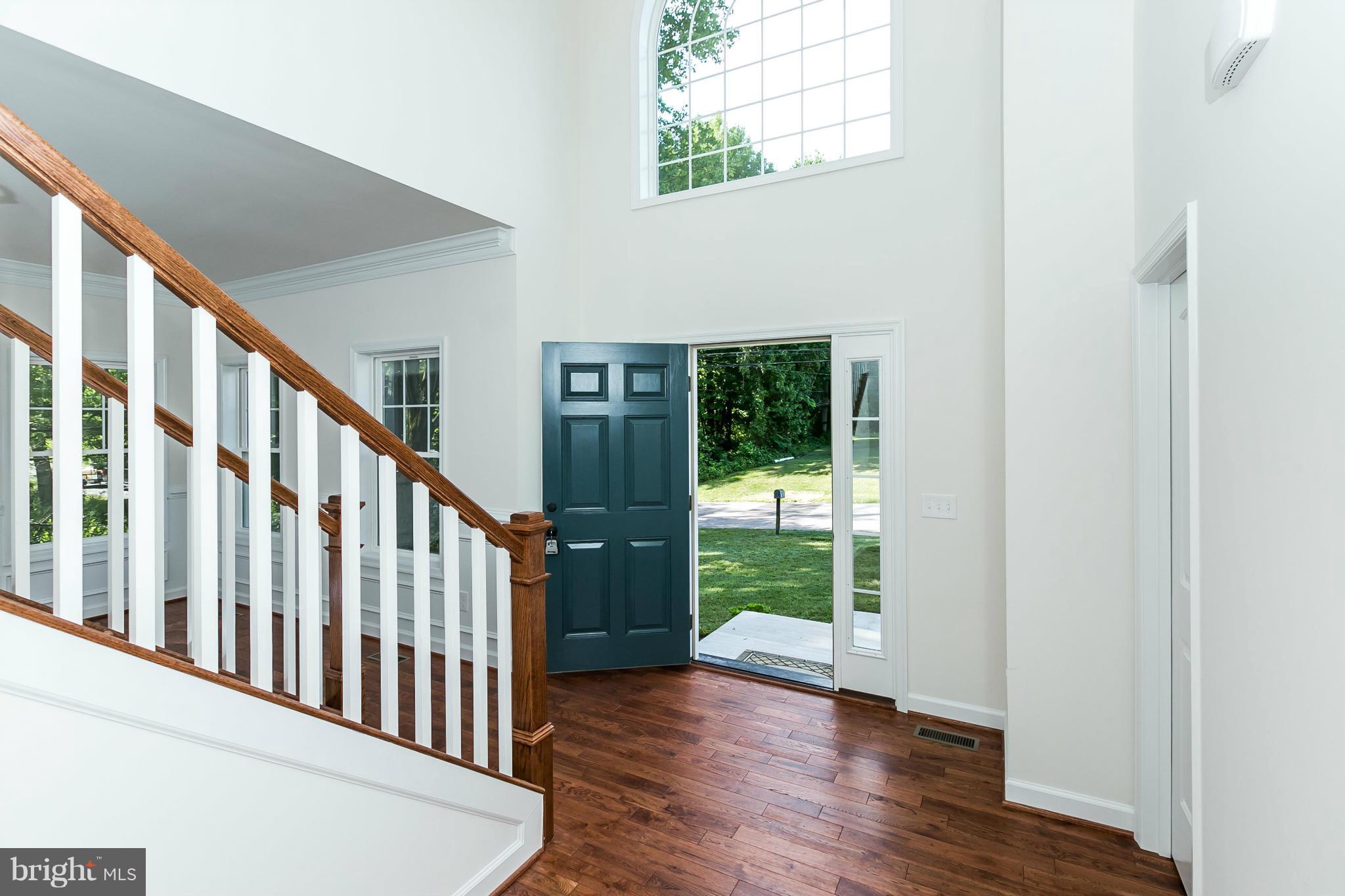 1074 Minnetonka Road Severn, MD 21144 - Photo 5 of 30 a view of staircase with wooden floor and fence