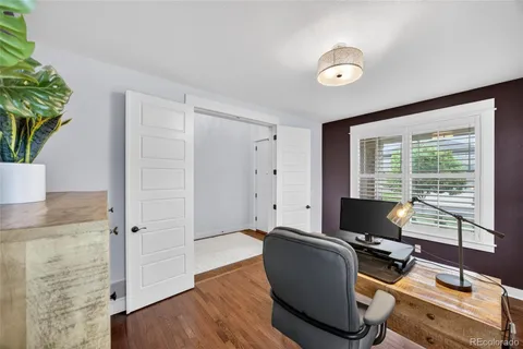 a kitchen with stainless steel appliances kitchen island granite countertop a refrigerator and a stove top oven