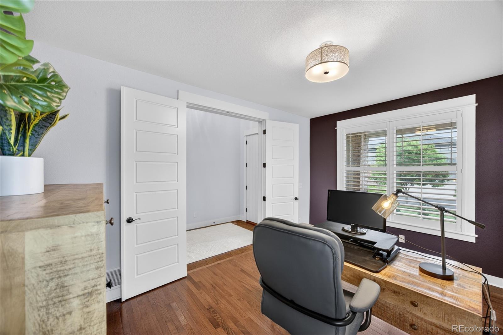 20554 East Shady Ridge Road Parker, CO 80134 - Photo 14 of 49 a view of a workspace with furniture and a window