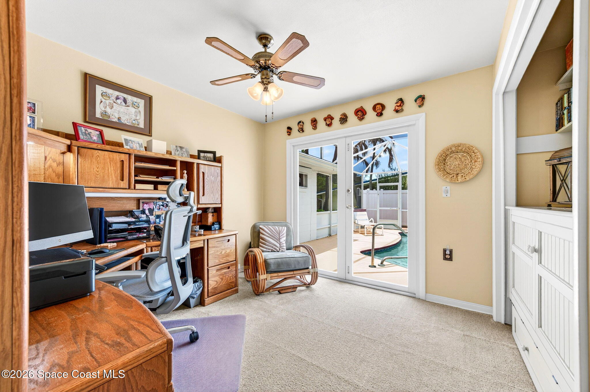 935 Samar Road Cocoa Beach, FL 32931 - Photo 17 of 22 a view of a livingroom with workspace and a window
