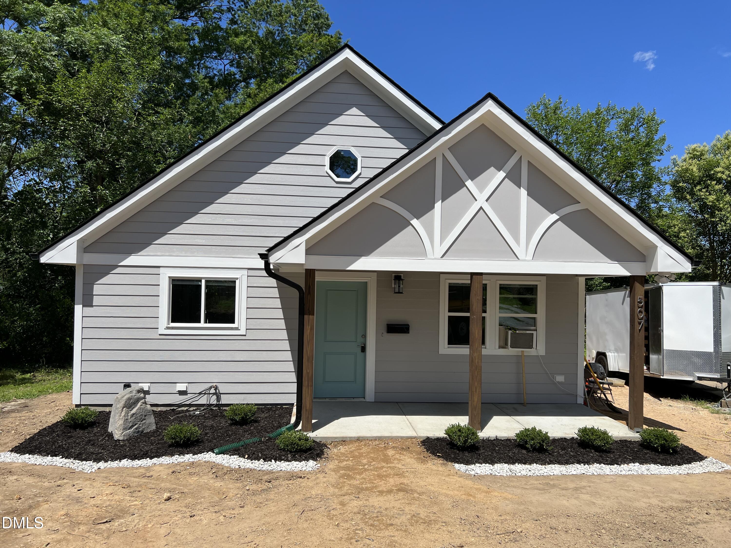 507 North Maple Street, Unit A Durham, NC 27703 - Photo 1 of 15 a front view of a house with garage