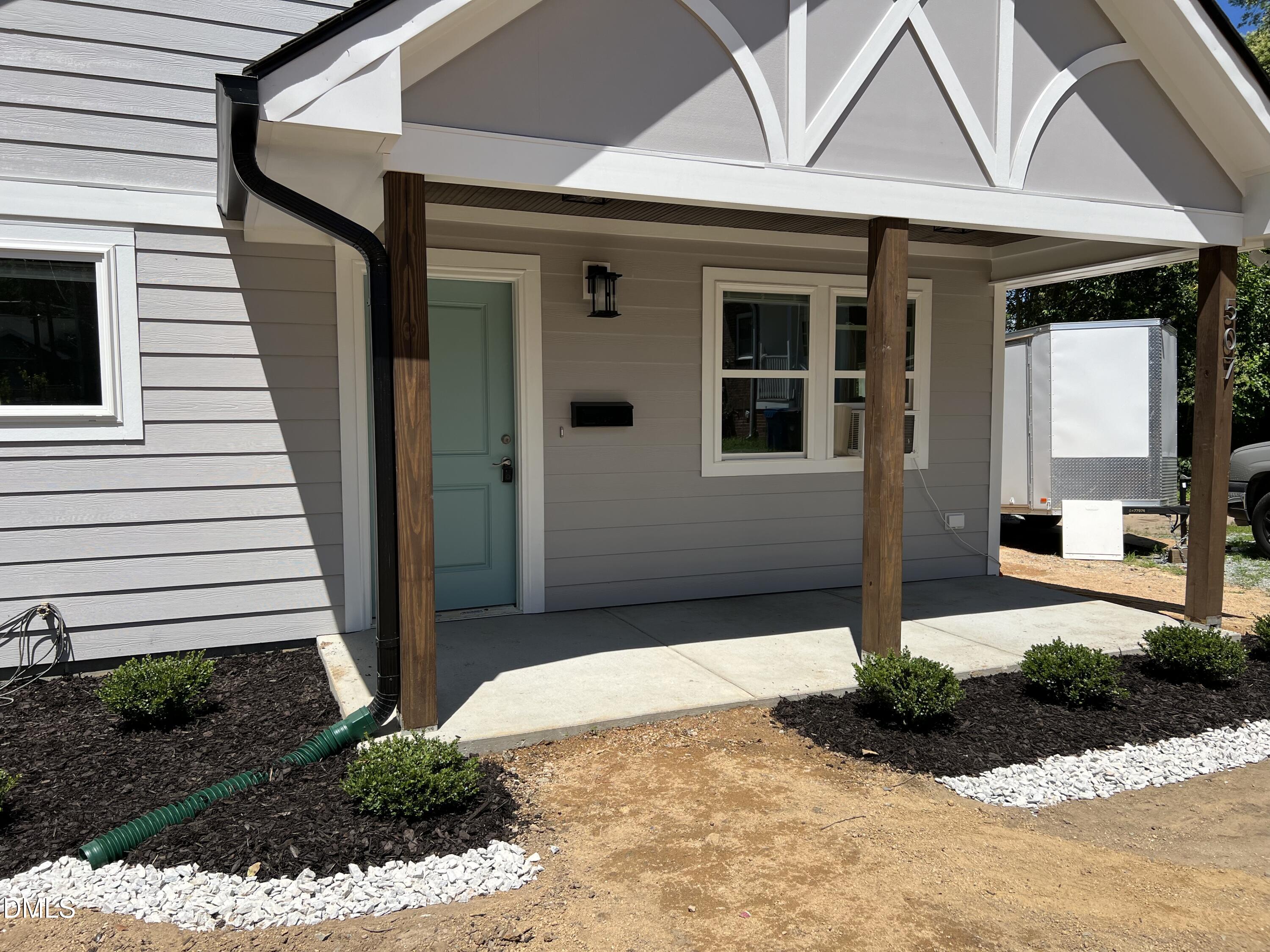 507 North Maple Street, Unit A Durham, NC 27703 - Photo 2 of 15 a front view of a house with a yard