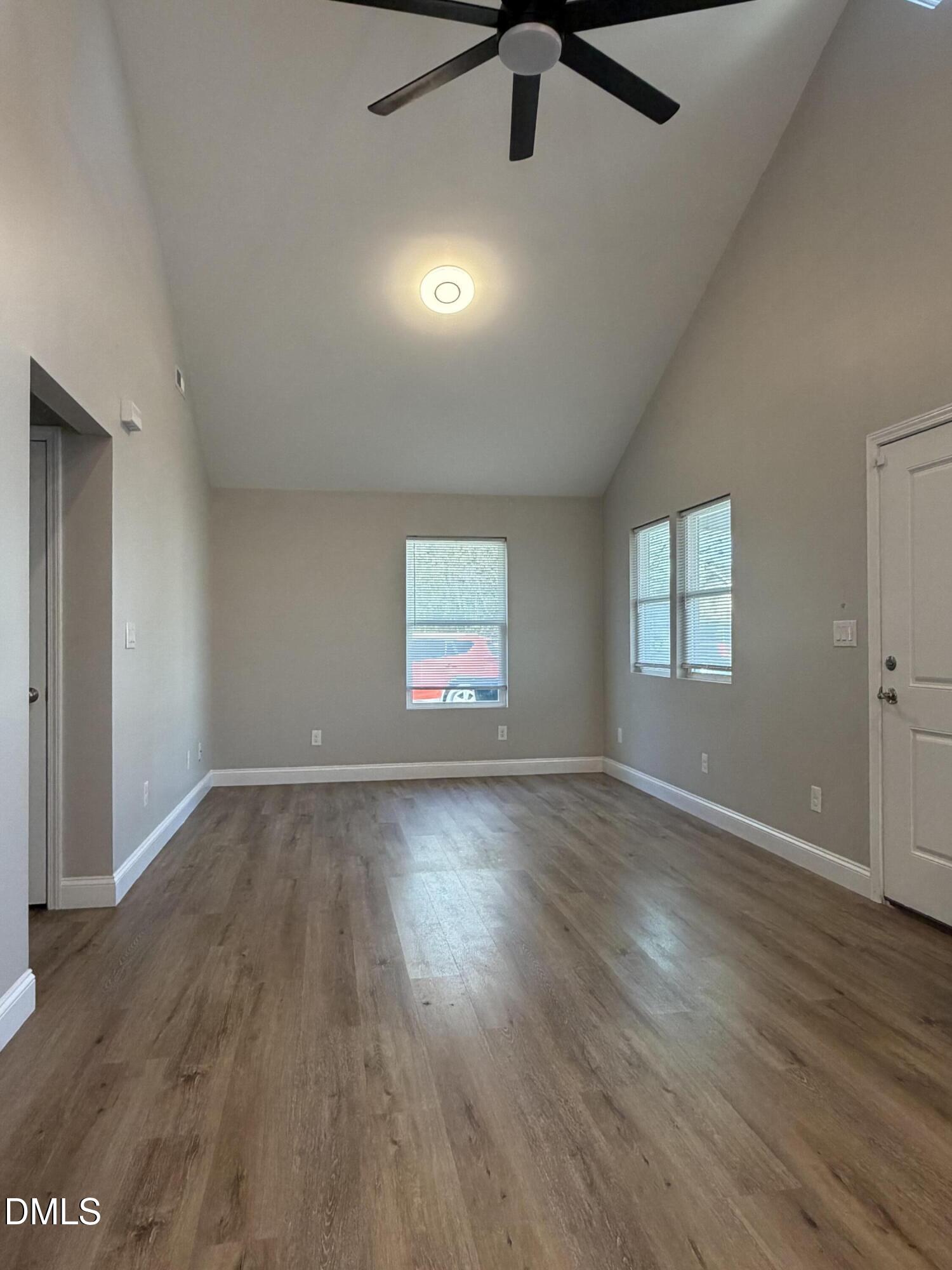 507 North Maple Street, Unit A Durham, NC 27703 - Photo 8 of 15 wooden floor in an empty room with a window