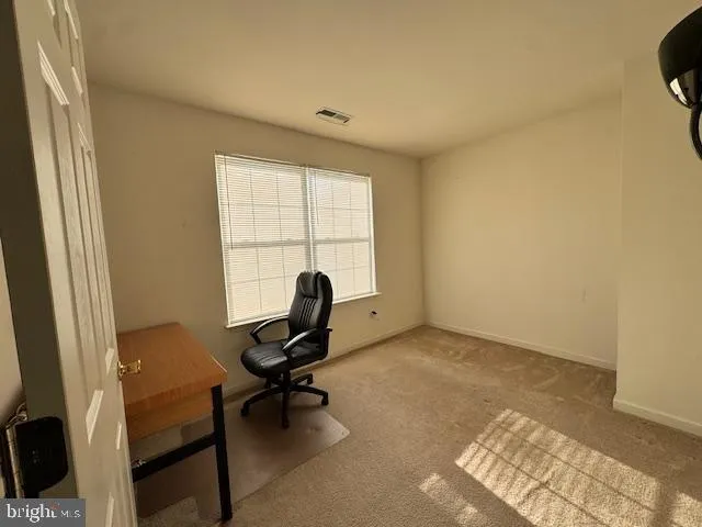 a workspace with furniture and a window