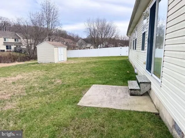 a view of backyard with green space