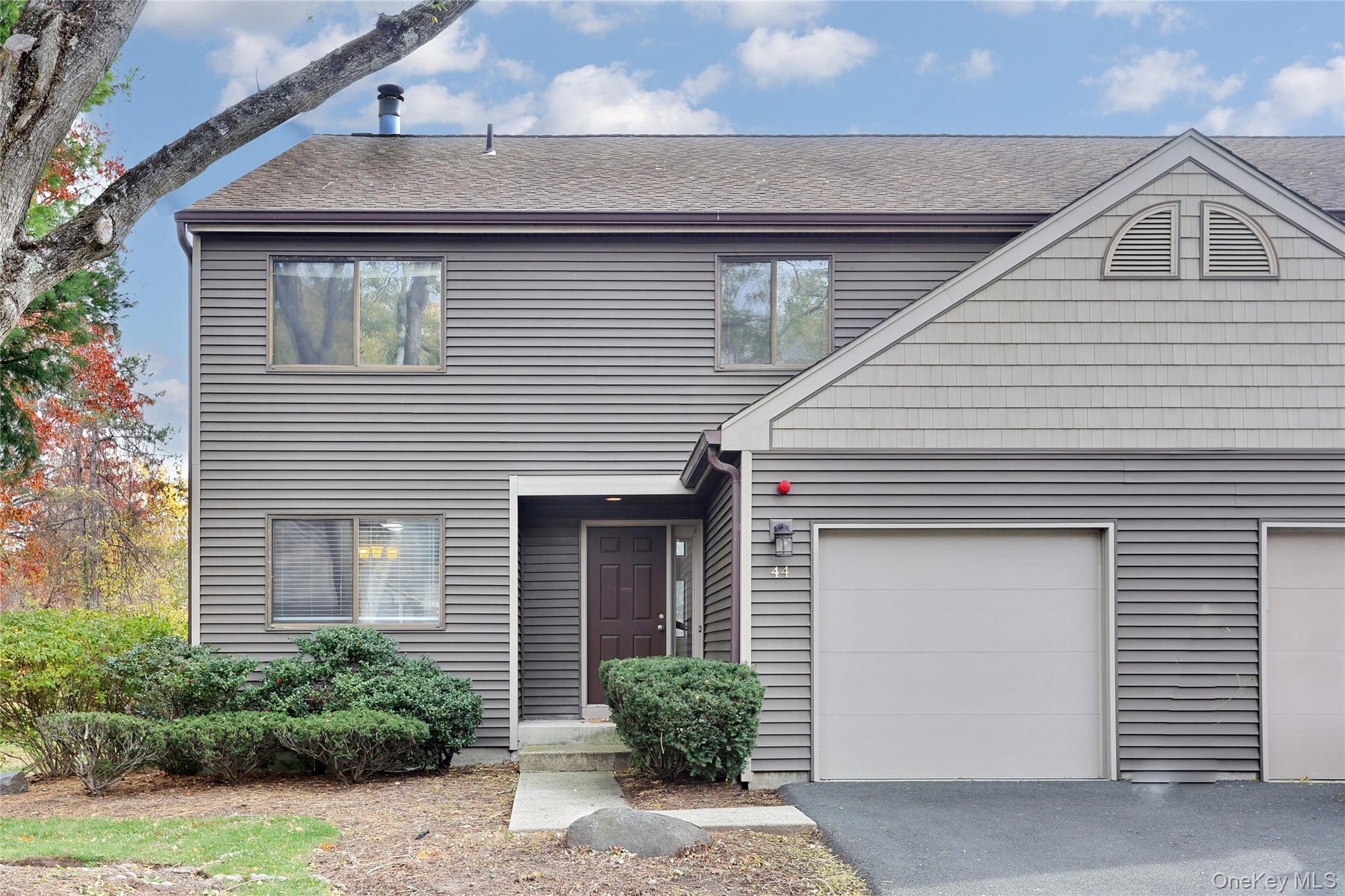 a front view of a house with garage