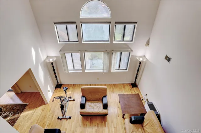 a view of living room with furniture and wooden floor