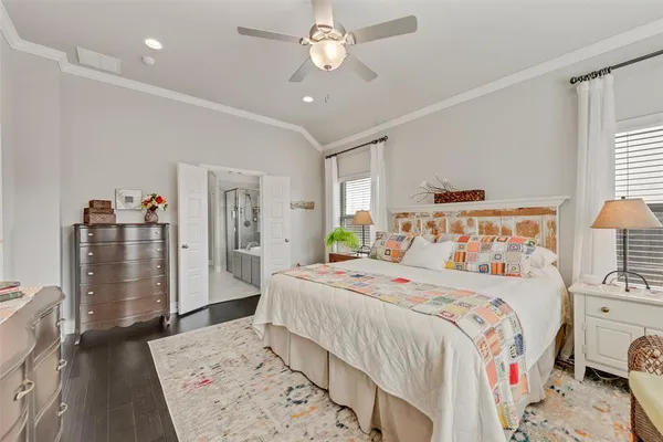 a bedroom with a bed dresser and a walk in closet
