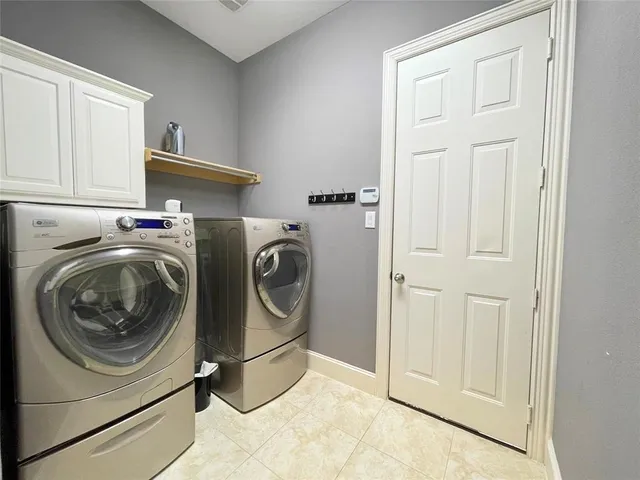 a bathroom with a granite countertop sink toilet and mirror