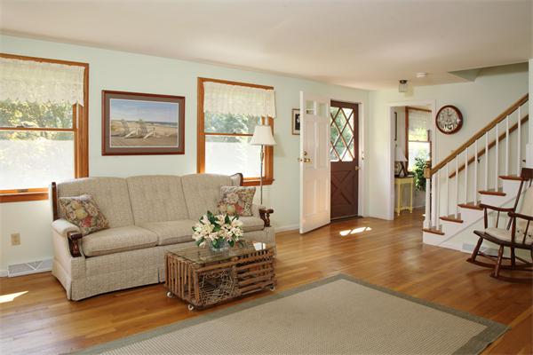 85 Oxbow Road Wayland, MA 01778 - Photo 2 of 8 a living room with furniture and wooden floor next to a window