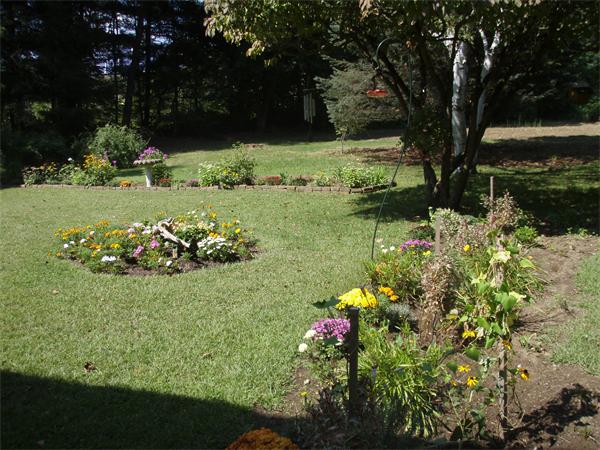 85 Oxbow Road Wayland, MA 01778 - Photo 8 of 8 a view of a garden with a lake