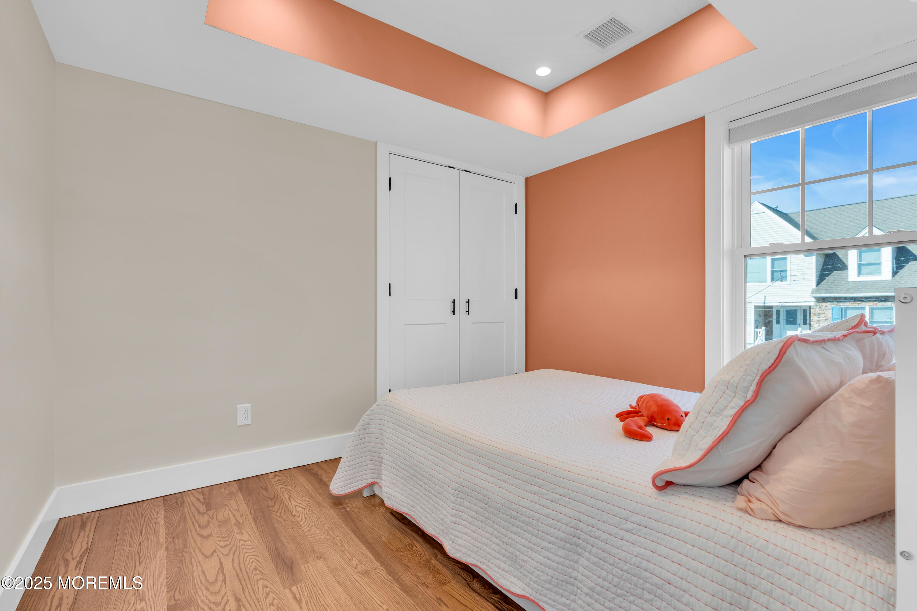 455 East Main Street Manasquan, NJ 08736 - Photo 13 of 47 a bedroom with a bed and a window