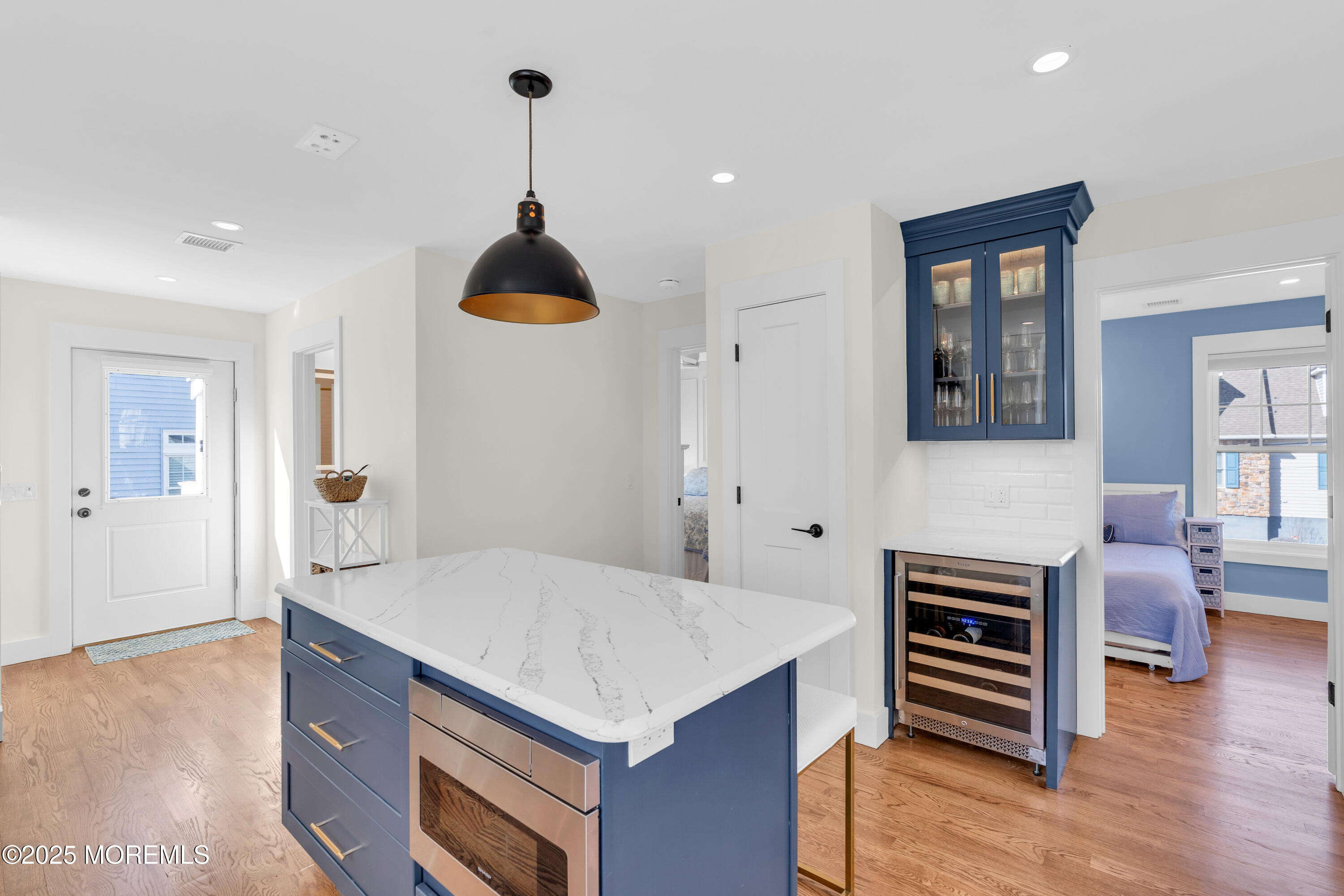 455 East Main Street Manasquan, NJ 08736 - Photo 24 of 47 a kitchen that has a table chairs and a refrigerator
