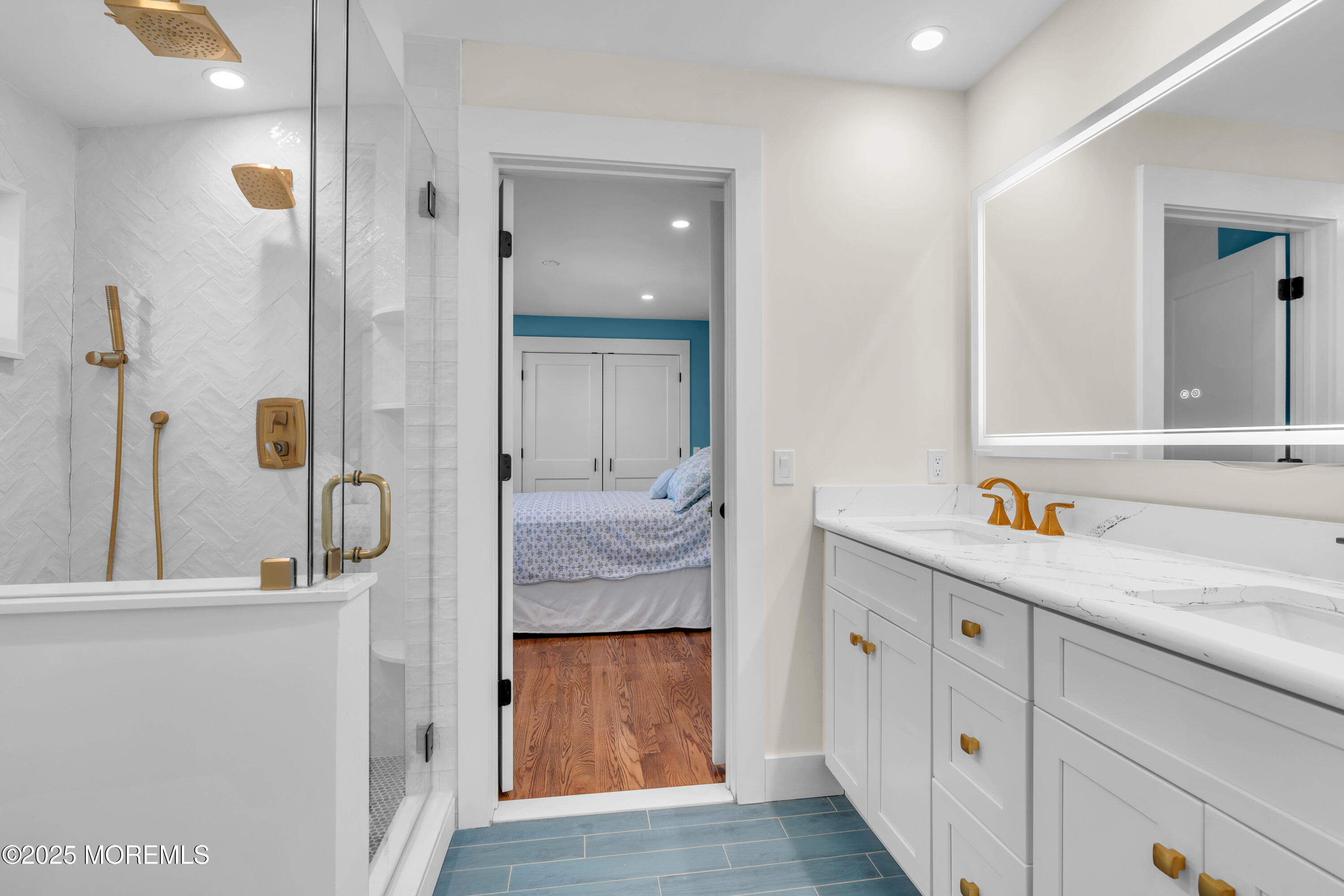 455 East Main Street Manasquan, NJ 08736 - Photo 35 of 47 a en suite bathroom with a granite countertop sink and a mirror