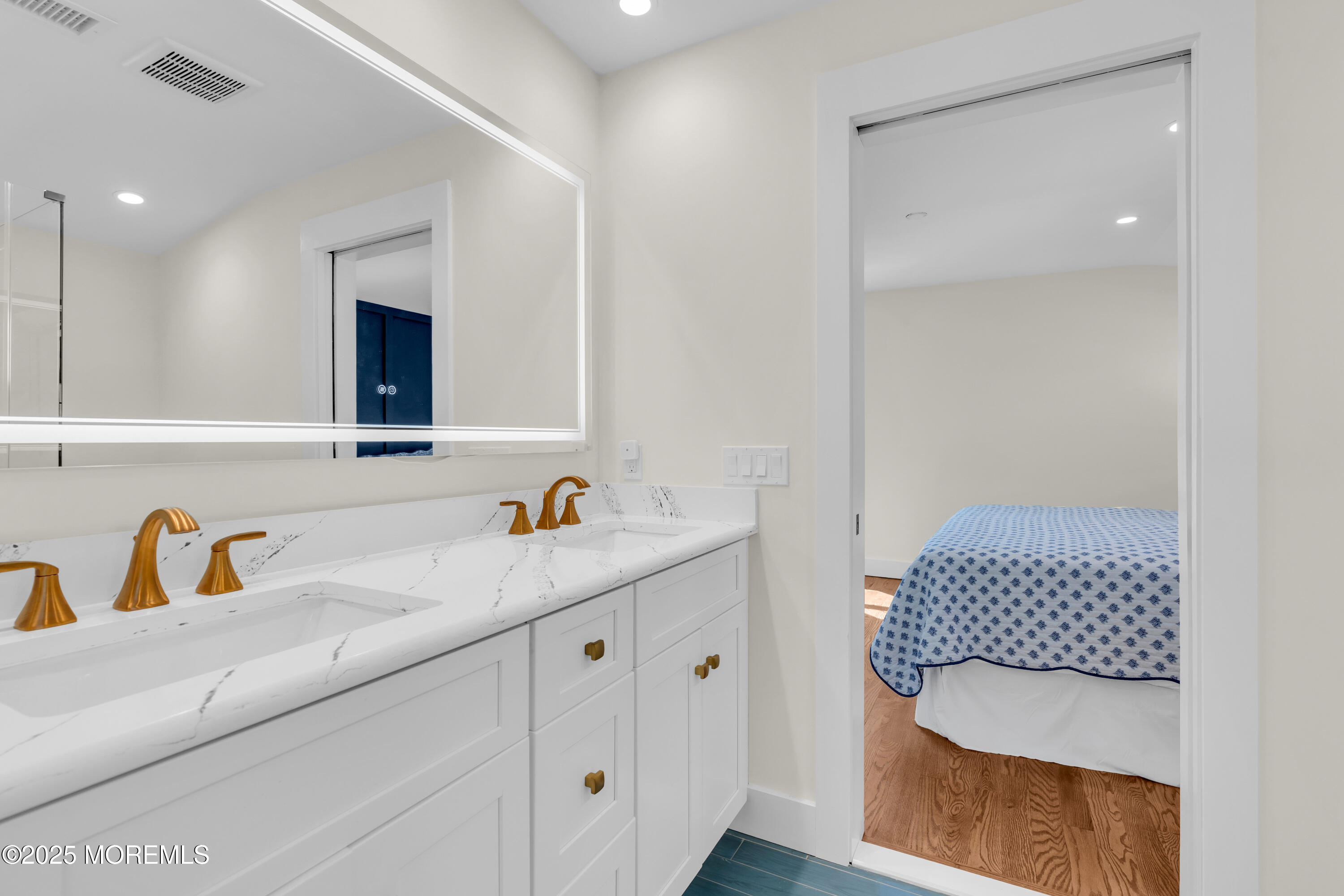 455 East Main Street Manasquan, NJ 08736 - Photo 36 of 47 a bathroom with a sink and a mirror