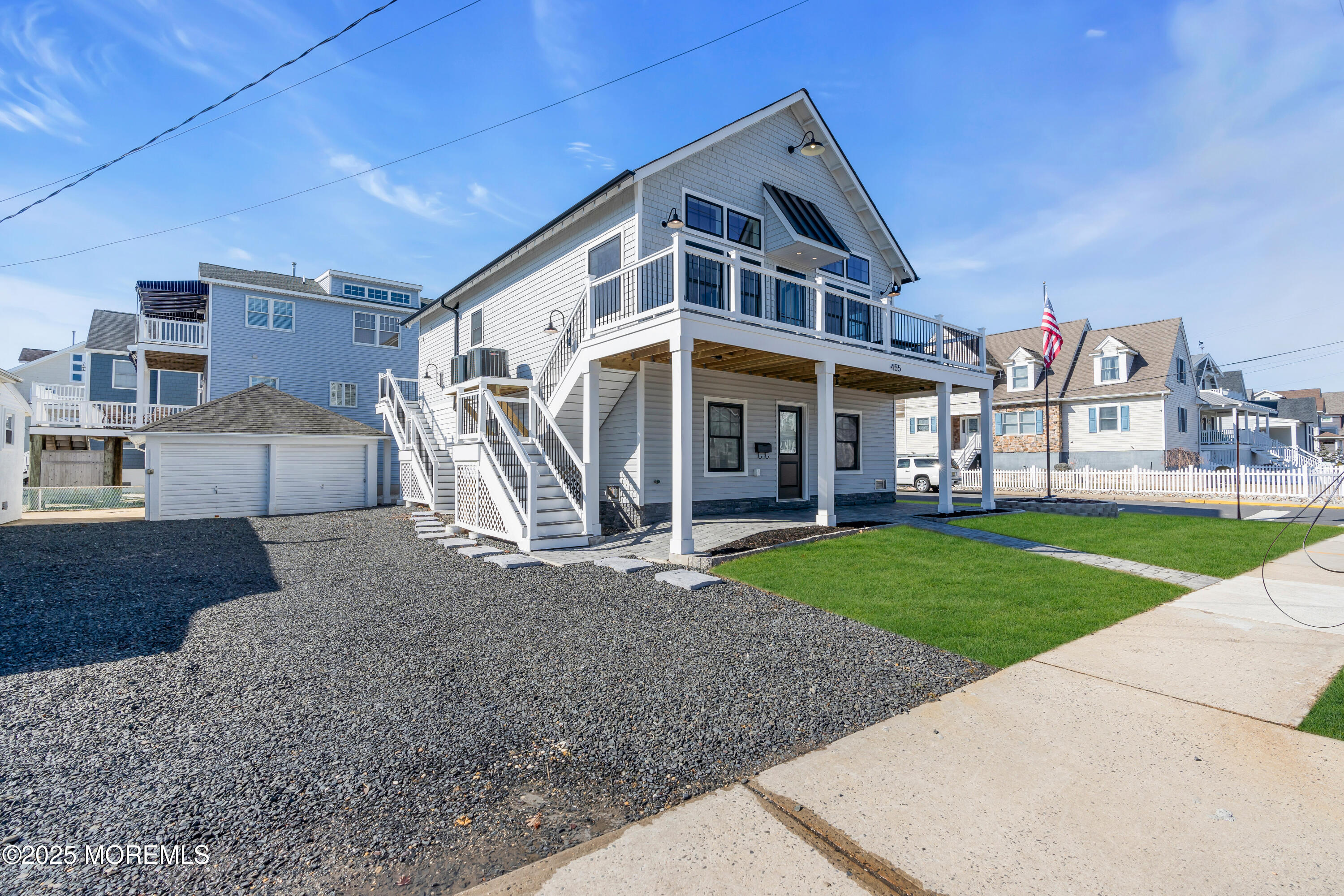 455 East Main Street Manasquan, NJ 08736 - Photo 4 of 47 a view of a big house with a big yard and large tree