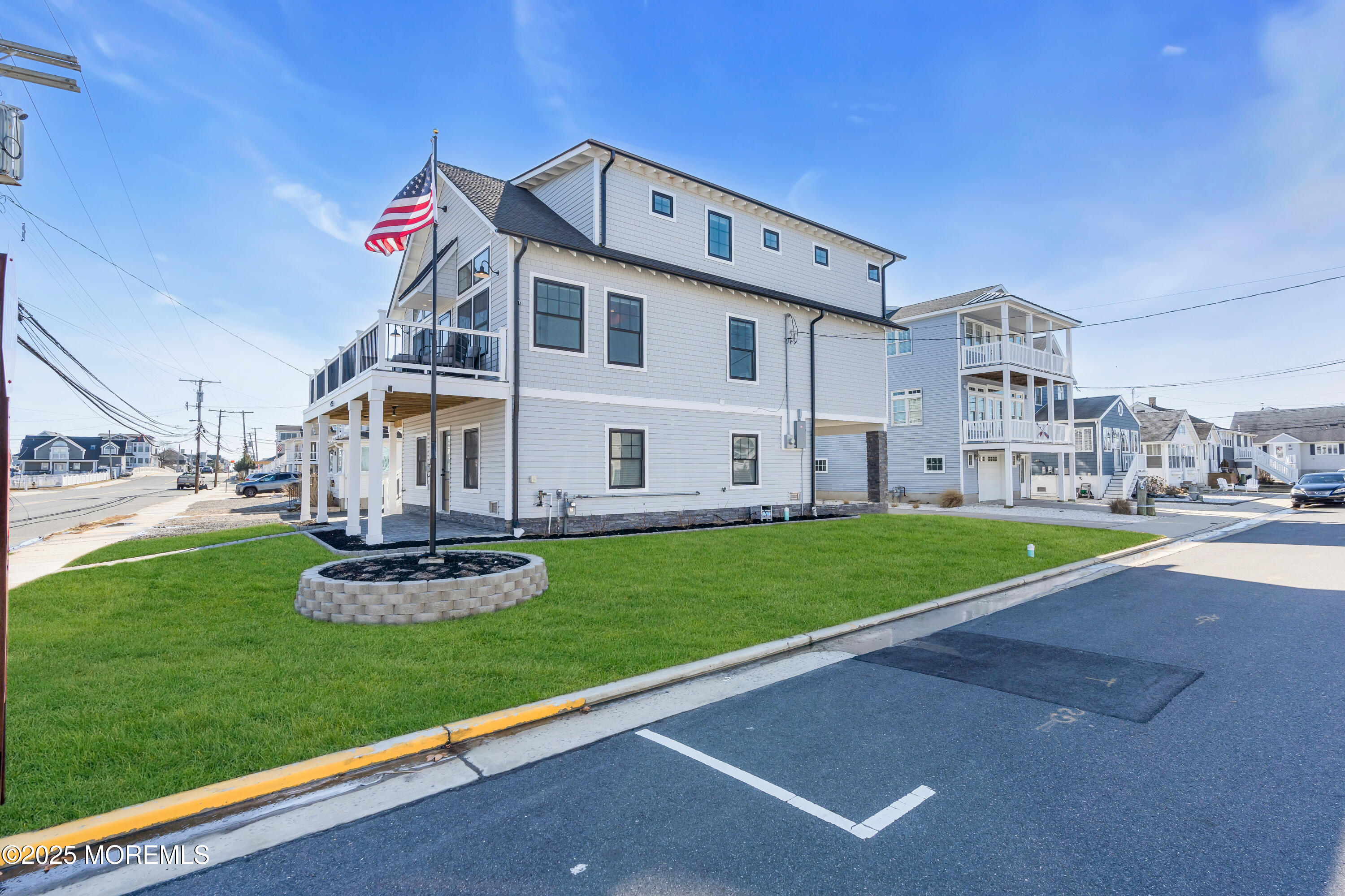 455 East Main Street Manasquan, NJ 08736 - Photo 5 of 47 a front view of a house with garden